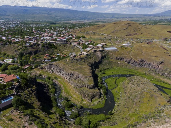 Aerial view of a scenic gorge with a small village and hills, aerial view, Kassagh River, Oskahan, Oshakan, Ošakan, Aragazotn Province, Armenia