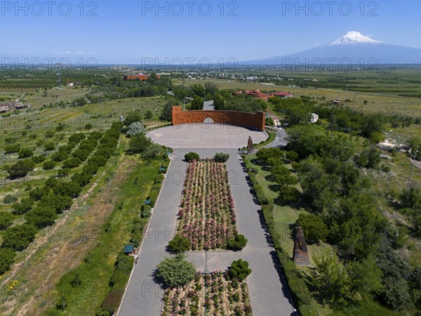 Landscape with symmetrical flower arrangements, a mountain in the background and a calm atmosphere, aerial view, Sardarapat monument, Araks village, Armavir province, in the background Mount Ararat in Turkey, Armenia