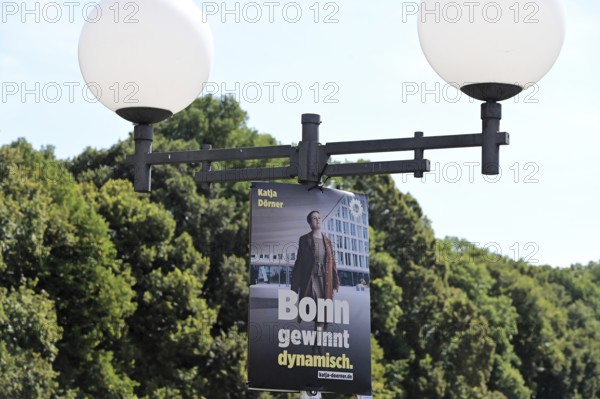 Posters for the North Rhine-Westphalia municipal election campaign in Bonn around the Hofgarten in the university district. Poster of the Green politician Katja Dörner