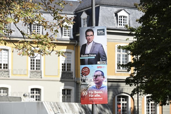 Posters for the North Rhine-Westphalia municipal election campaign in Bonn around the Hofgarten in the university district. CDU politician Guido Deus and SPD politician Jochen Reeh-Schall