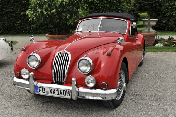 Jaguar Coupe, Vintage car, Red Jaguar vintage car with an elegant and classic design on gravel floor, Retro Classics meets Baroque, Ludwigsburg, Baden-Württemberg, Germany