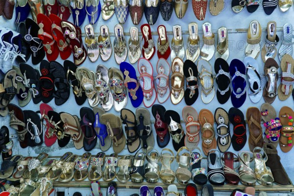 Udaipur, Rajasthan, North India, Asia, Collection of colourful shoes and sandals in a shop