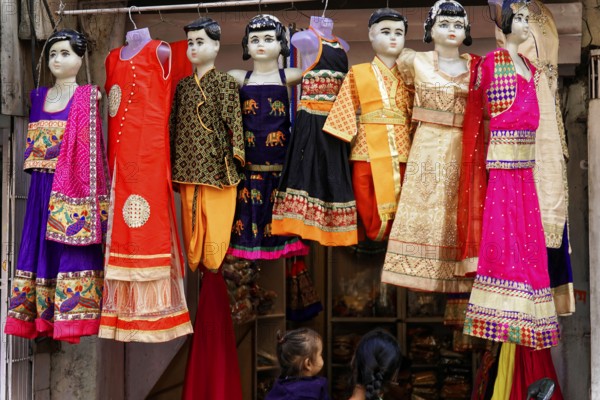 Udaipur, Rajasthan, North India, Asia, Colourful traditional dresses on mannequins in a shop