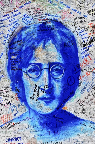 John Lennon wall, graffiti, Prague, Czech Republic, Europe, close-up of a blue portrait of John Lennon with surrounding graffiti messages