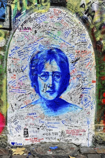 John Lennon wall, graffiti, Prague, Czech Republic, Europe, John Lennon's portrait in blue with surrounding messages and graffiti on a wall