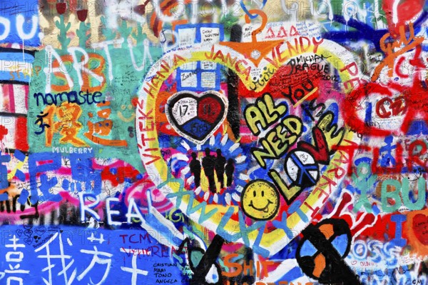 Colourful graffiti wall with heart motifs and peaceful messages, Prague, Czech Republic