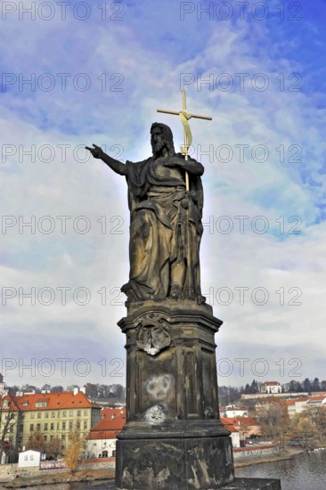 Statue on Charles Bridge, Old Town, UNESCO World Heritage Site, Prague, Czech Republic, Europe, Monumental statue with cross, pointing to the sky