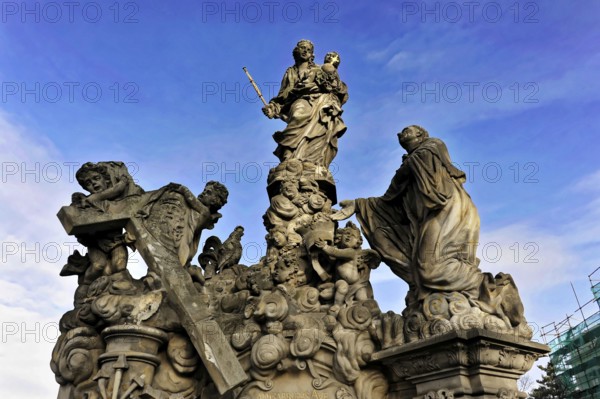 Prague, Czech Republic, Europe, Baroque religious sculptures, dramatic against the sky