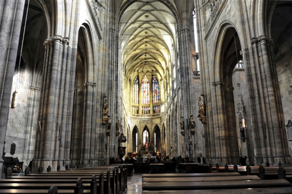 St Vitus or St Vitus Cathedral, Hradcany, Prague, Czech Republic, Europe, Elongated nave with pews and impressive stone carvings