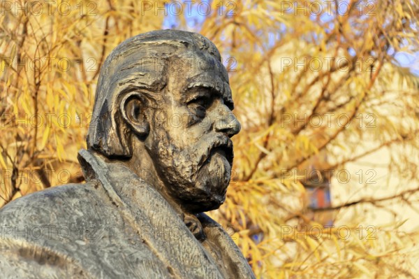 Smetana Monument, Prague, Czech Republic, Europe, Close-up of a bronze statue with autumn leaves in the background