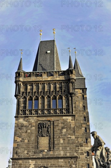 Prague, Czech Republic, Europe, Historic, mighty tower in Gothic style with battlements and figurative details