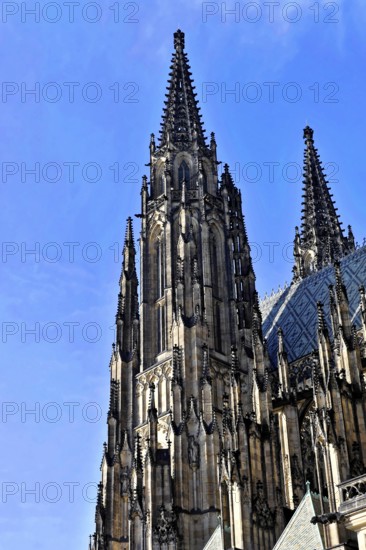 St Vitus or St Vitus Cathedral, Hradcany, Prague, Czech Republic, Europe, Detailed Gothic church tower with steep spires against a clear blue sky