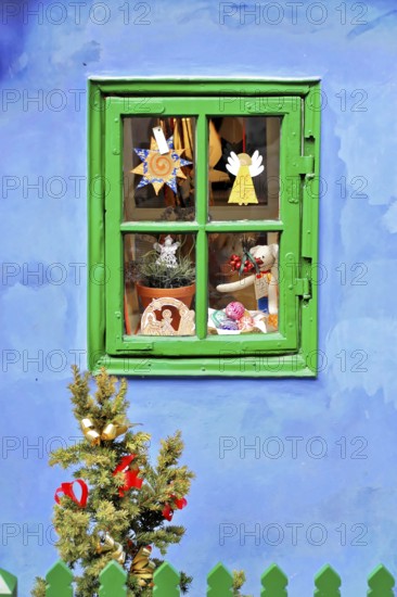 Prague, Czech Republic, Europe, Close-up of a decorated window with colourful toys and presents
