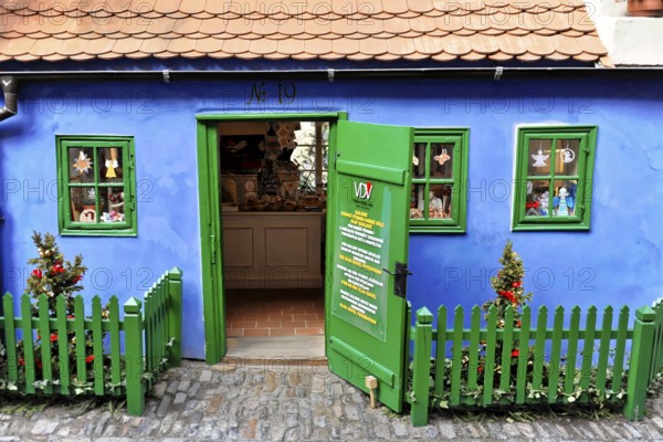 Prague, Czech Republic, Europe, Small blue house with green fence and decorative details in bright colours