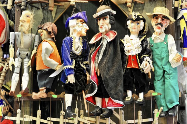 Prague puppets, Prague, Czech Republic, Europe, Differently dressed puppets lined up, colourful and lively, with historical outfits