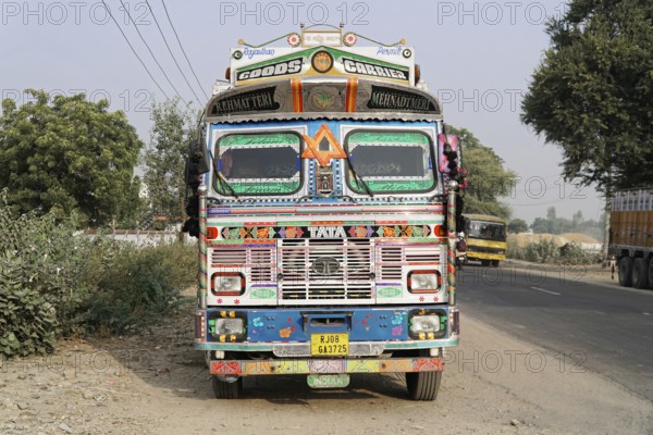 Kota, Rajasthan, North India, Asia, Decorated Indian lorry with detailed decoration on a country road, India