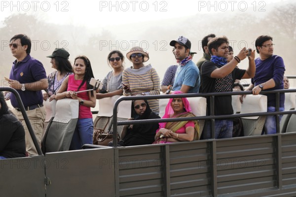 Ranthambhore Tiger Reserve, Sawai Madhopur, Kota, Rajasthan, North India, Asia, Group of people on safari vehicle, attentive and taking pictures, India