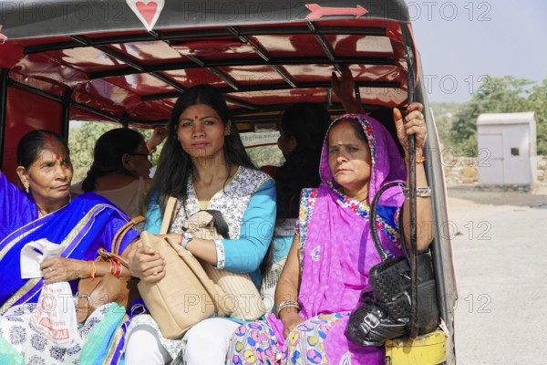 Kota, Rajasthan, North India, Asia, Close-up of woman in colourful traditional dress in an autorickshaw, India