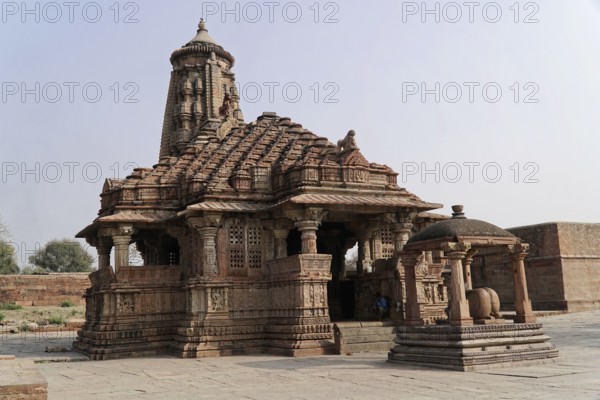 Kota, Rajasthan, North India, Asia, Historic temple with intricate stone carvings in a tranquil setting, India