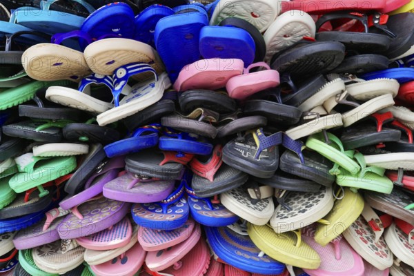 Kota, Rajasthan, North India, Asia, pile of colourful plastic sandals expressing diversity and vibrancy, India