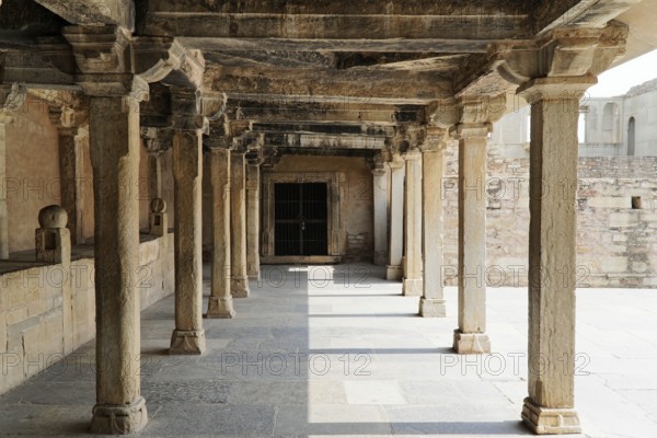 Kota, Rajasthan, North India, Asia, An old stone colonnade full of shadow and light, part of a historical architecture, India