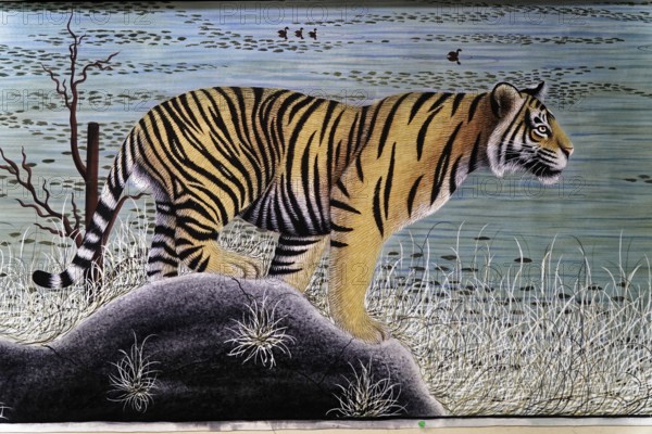 Painting, Sale, Souvenir, Udaipur, Rajasthan, India, Asia, A lifelike painting of a tiger standing on a rock by a water body, North India