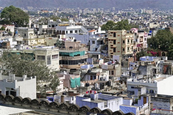 Udaipur, Rajasthan, North India, Asia, Urban landscape with densely packed, colourful houses in an Indian city