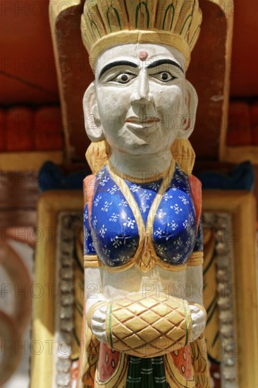 Udaipur, Rajasthan, North India, Asia, Close-up of a skilfully carved wooden figure in traditional dress