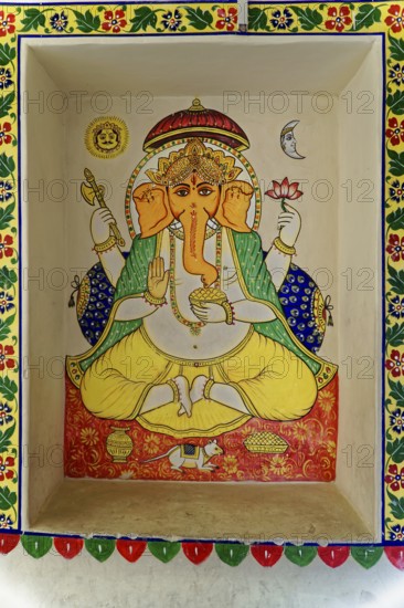 Udaipur, Rajasthan, North India, Asia, Ganesha mural in bright colours with floral details and traditional decorations