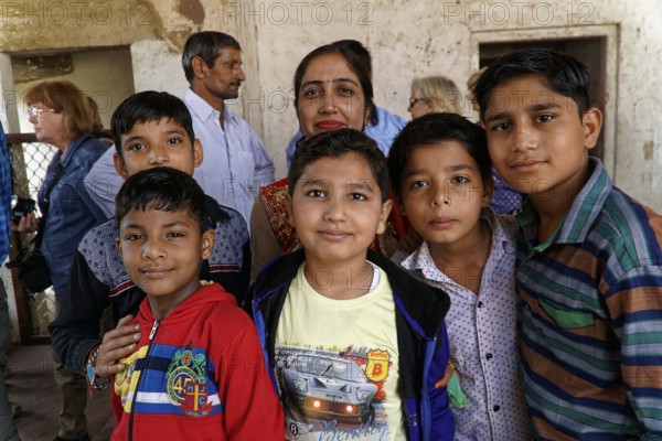 Red Fort, Agra, Uttar Pradesh, India, Group of children smiling friendly in a simple interior with a pleasant atmosphere, Jodhpur, Rajasthan, North India