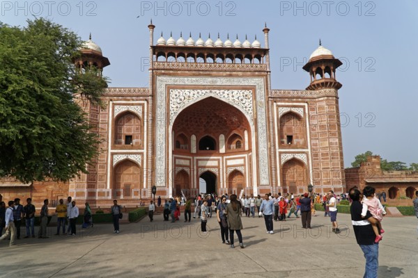 Tomb of Akbar the Great, Sikandra, Agra, Uttar Pradesh, North India, India, Asia, Historic red sandstone Tor tor with elaborately decorated arches and a crowd of people in front of it, Jodhpur, Rajasthan