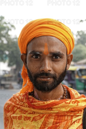 Agra, Jodhpur, Rajasthan, North India, AsiaPortrait of a man with orange turban and traditional clothes, Asia