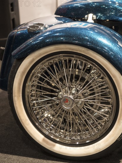 Rear tyre of a motorbike with chrome rim and retro-style wire spokes, dortmund, deutchland