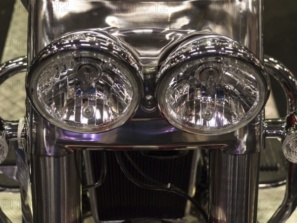 Detailed photo of the chrome headlights of a motorbike, shiny and reflective, dortmund, deutchland