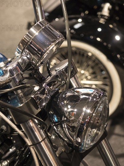 Chrome headlights with detailed wiring on a classic motorbike, dortmund, deutchland
