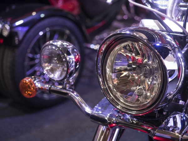 Shiny chrome headlights on a vintage-style motorbike, dortmund, deutchland