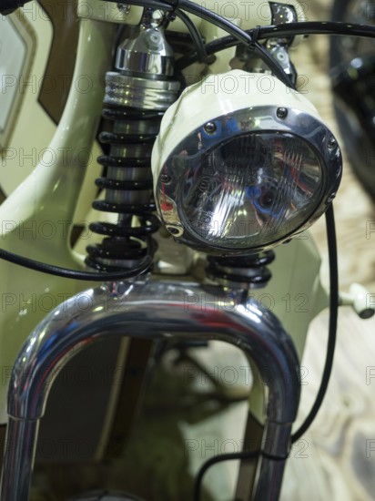 Close-up of a motorbike headlight and suspension in vintage style, dortmund, deutchland