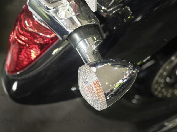 Detailed view of a motorbike tail light and indicator in chrome with black paint, dortmund, deutchland