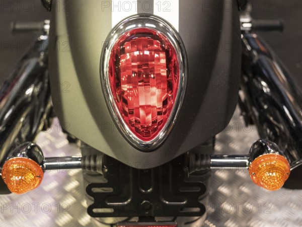 Close-up of a motorbike tail light with red and orange indicators, dortmund, deutchland