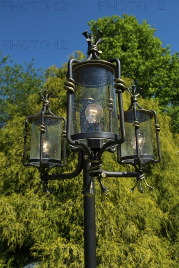 Decorative lantern with clear sky and tree in the background, südlohn, westphalia, germany