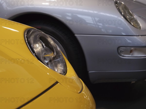 Details of yellow and silver Porsche showing headlights and luxurious design, Cologne, Germany