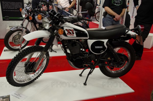 Retro motorbike on display with black and white colour design, ready for off-road adventures, dortmund, germany