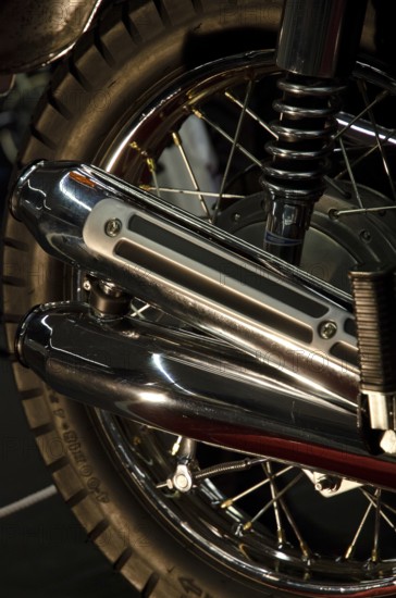 Close-up of a chrome exhaust and tyre of a retro-style motorbike, dortmund, germany