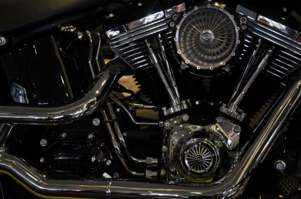 Close-up of a shiny motorbike engine block with visible valves and fan, dortmund, germany