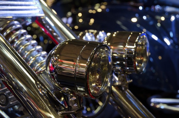 Detailed view of shiny headlights on a motorbike with light-reflecting atmosphere, dortmund, germany