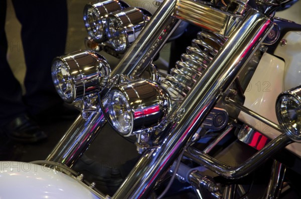 Front part of a motorbike with shiny chrome headlights and white design, dortmund, germany