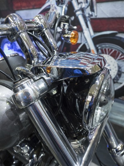 Close-up of the front of a motorbike with shiny chrome details and headlights, dortmund, germany