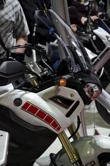Modern motorbike with sporty design and black windscreen at a trade fair, dortmund, germany
