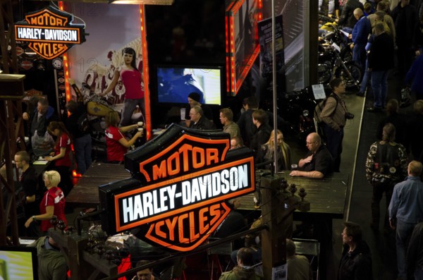 Harley-Davidson trade fair with visitors and prominent signs, dortmund, germany