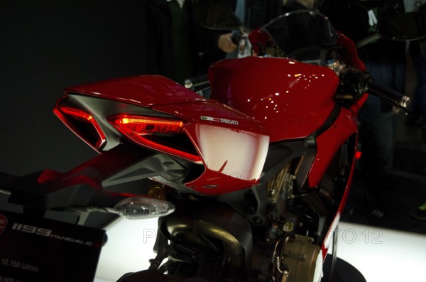 Sporty red motorbike with detailed rear design at an exhibition, dortmund, germany